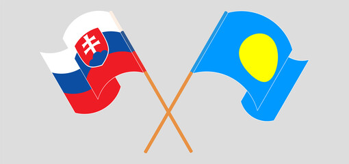 Crossed and waving flags of Slovakia and Palau
