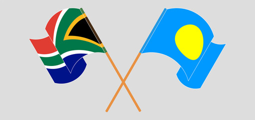 Crossed and waving flags of South Africa and Palau