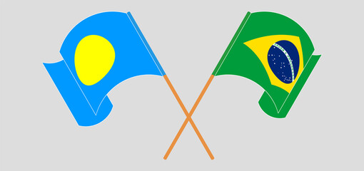 Crossed and waving flags of Palau and Brazil