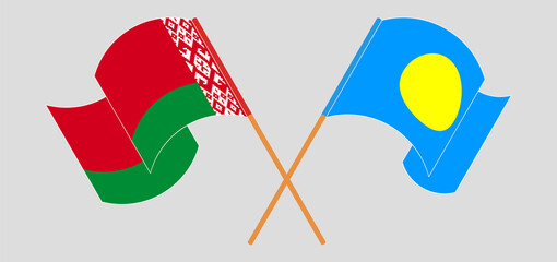 Crossed and waving flags of Belarus and Palau