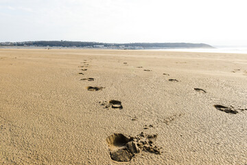 Footprints on a sandy beach