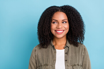 Photo of pretty positive lady toothy smile look interested empty space isolated on blue color background
