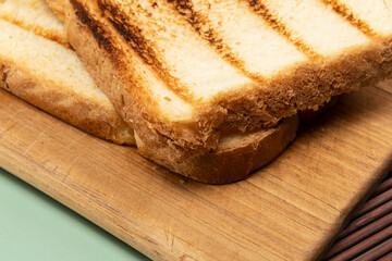 loaf of bread toast on top of wooden board
