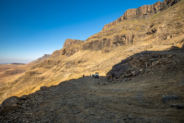Valley and winding road over mountains from South Africa to Lesotho over Sani Pass.