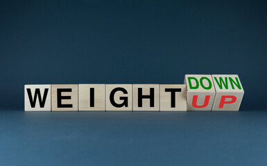 Cubes form words Weight down or Weight up. Concept of weight management, the transition to a healthy diet and lifestyle