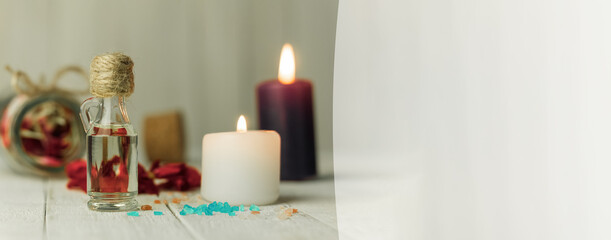 Aroma oil bottle and aroma candles, background with space for text