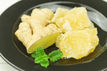 Fresh ginger root and candied ginger in sugar