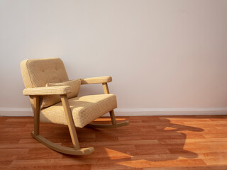 rocking chair in the corner of a room with old hardwood flooring. front view