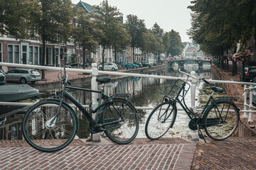 Bicycles and typical Dutch houses in Leiden, Netherlands - 508235606