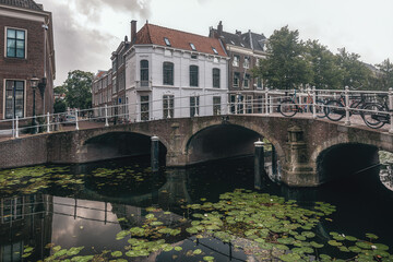 View of the pleasant center of the student city of Leiden with beautiful old canal houses along the canals. - 508235611