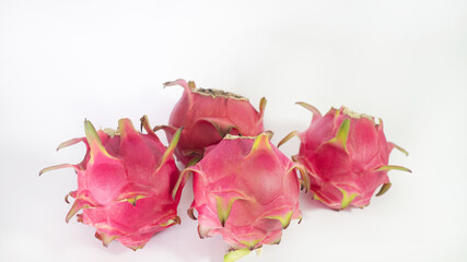 RED PITAHAYA DRAGÓN FRUIT ON A WHITE BACKGROUND WITH SPACE FOR TEXT, HEALTHY DIET WITH EXOTIC TROPICAL FRUITS