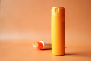 Close up of sunscreen cream in a pink container 