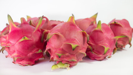 RED PITAHAYA DRAGÓN FRUIT ON A WHITE BACKGROUND WITH SPACE FOR TEXT, HEALTHY DIET WITH EXOTIC TROPICAL FRUITS