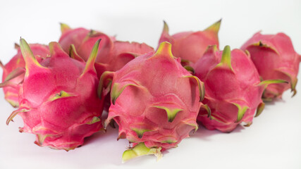 RED PITAHAYA DRAGÓN FRUIT ON A WHITE BACKGROUND WITH SPACE FOR TEXT, HEALTHY DIET WITH EXOTIC TROPICAL FRUITS