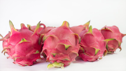 RED PITAHAYA DRAGÓN FRUIT ON A WHITE BACKGROUND WITH SPACE FOR TEXT, HEALTHY DIET WITH EXOTIC TROPICAL FRUITS