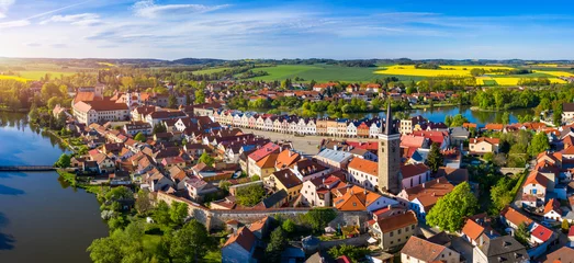 Fotobehang Aerial landscape of small Czech town of Telc with famous Main Square (UNESCO World Heritage Site). Aerial panorama of old town Telc, Southern Moravia, Czechia. Historic centre of Telc, Czech Republic. © daliu