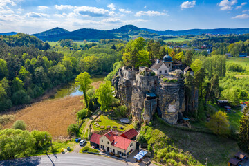 Fototapeta na wymiar Aerial view of Sloup Castle in Northern Bohemia, Czechia. Sloup rock castle in the small town of Sloup v Cechach, in the Liberec Region, north Bohemia, Czech Republic.