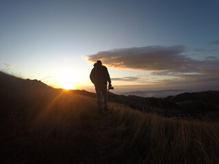 Trekking at Quiriri's Fields. Cold sunny morning, winter. Walking through the sun.