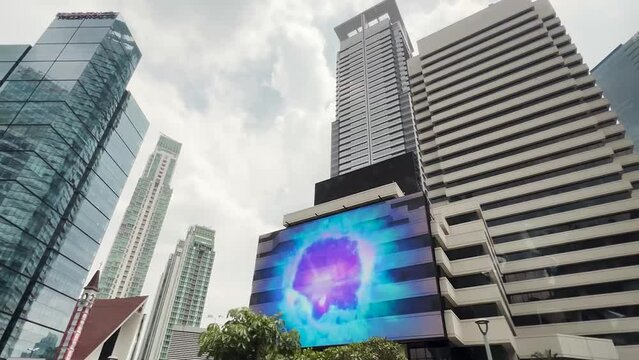 Futuristic Virtual Reality UFO Flying LED Panel Display Screen on a Building City