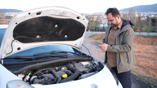 man calling car mechanic