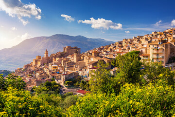 Caccamo, Sicily. Medieval Italian city with the Norman Castle in Sicily mountains, Italy. View of Caccamo town on the hill with mountains in the background, Sicily, Italy.