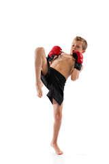 Closeup portrait of little boy, kid in sports shots and gloves posing on white studio background....