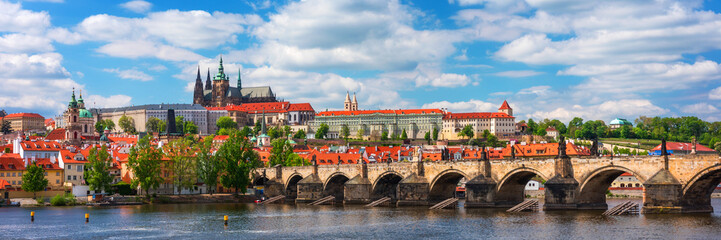 Obraz premium Scenic view of the Old Town pier architecture and Charles Bridge over Vltava river in Prague, Czech Republic. Prague iconic Charles Bridge (Karluv Most) and Old Town Bridge Tower at sunset, Czechia.