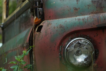 old rusted car headlight