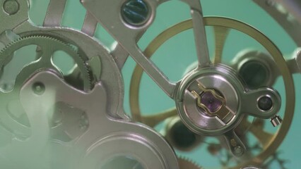 Macro close-up detail of mechanic clock gears motion