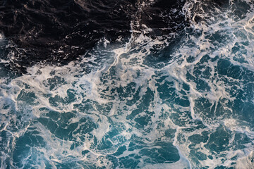 Sea foam on ocean water