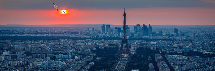 View of Paris with Eiffel Tower from Montparnasse building. Eiffel tower view from Montparnasse at sunset, view of the Eiffel Tower and La Defense district in Paris, France. - obrazy, fototapety, plakaty