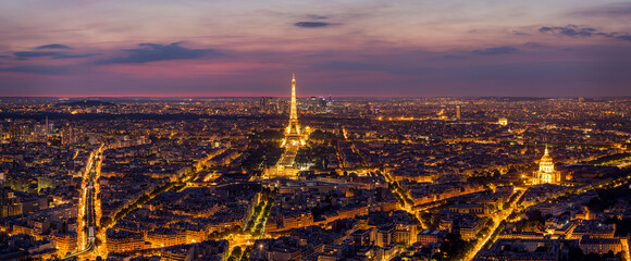 Paris Skyline at Night. Paris, France skyline, panorama at night. The view from Montpanasse Tower. Paris skyline by night. With illuminated city, Invalides, and arc de Triomphe. Paris, France. - obrazy, fototapety, plakaty