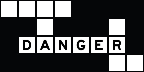 Alphabet letter in word danger on crossword puzzle background