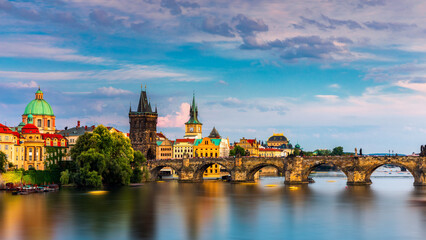 Charles Bridge in Prague in Czechia. Prague, Czech Republic. Charles Bridge (Karluv Most) and Old Town Tower. Vltava River and Charles Bridge. Concept of world travel, sightseeing and tourism.