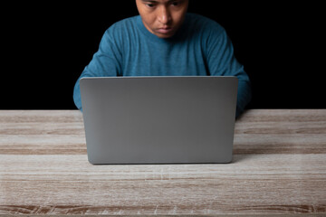 Man working with computer laptop searching browsing internet data.