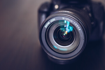 DSLR camera isolated on a black background. Black DSLR Camera isolated. Photo Camera or Video lens...