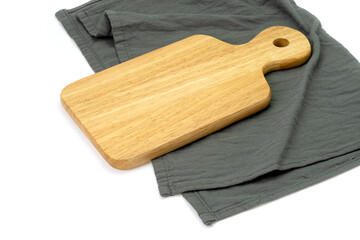 Empty wooden tray with cloth isolated on white background. Mock up. Selective focus.