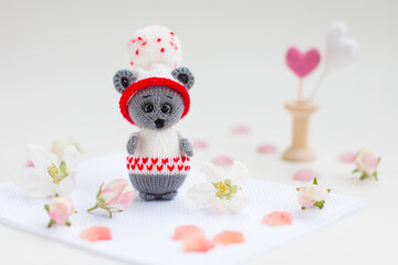 A small knitted mouse toy. Hand made