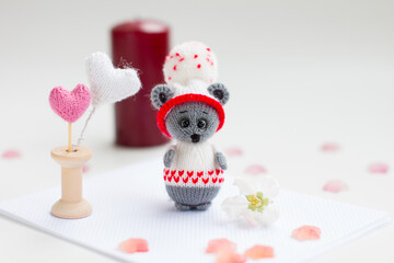A small knitted mouse toy. Hand made
