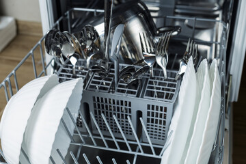 Washing dishes. dishes and pots in the dishwasher. well washed dishes