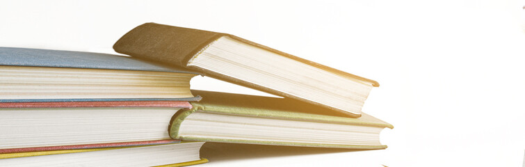 Stack of books on white background with copy space. Vintage books stack.