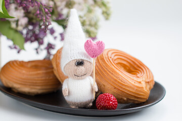 A little gnome knitted with knitting needles. Gift for children holiday card