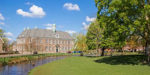 Fototapeta na wymiar Panorama of the park and historic school building in Veendam, Netherlands