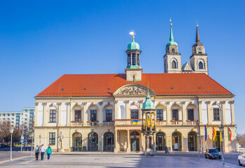 Fototapeta na wymiar Front view of the historic town hall and church in Magdeburg, Germany