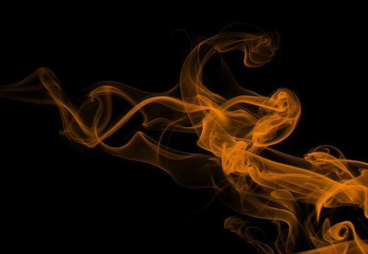 Yellow smoke abstract on black background, darkness concept