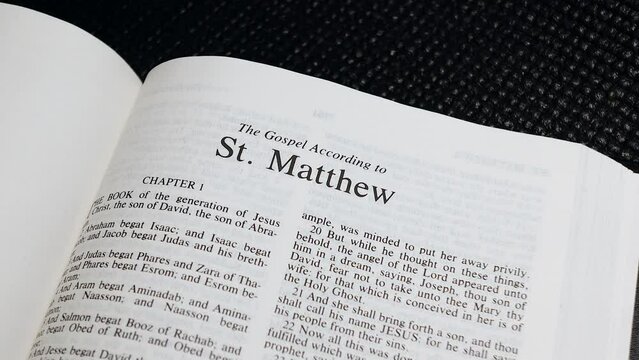 Close Up Shot of  Bible Page Turning to the book of Matthew
