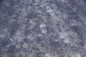 Footprints of sneakers on the asphalt