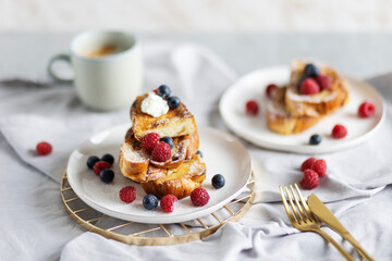 French cinnamon toast with blueberries, raspberries, sugar and coffee. Morning breakfast. French breakfast. 