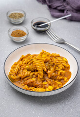 Red sauce pasta slow-cooked in tomato sauce, prepared with flavourful spices