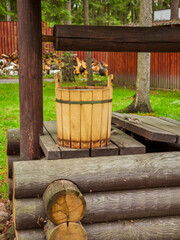 an old water well with a pulley and also a bucket